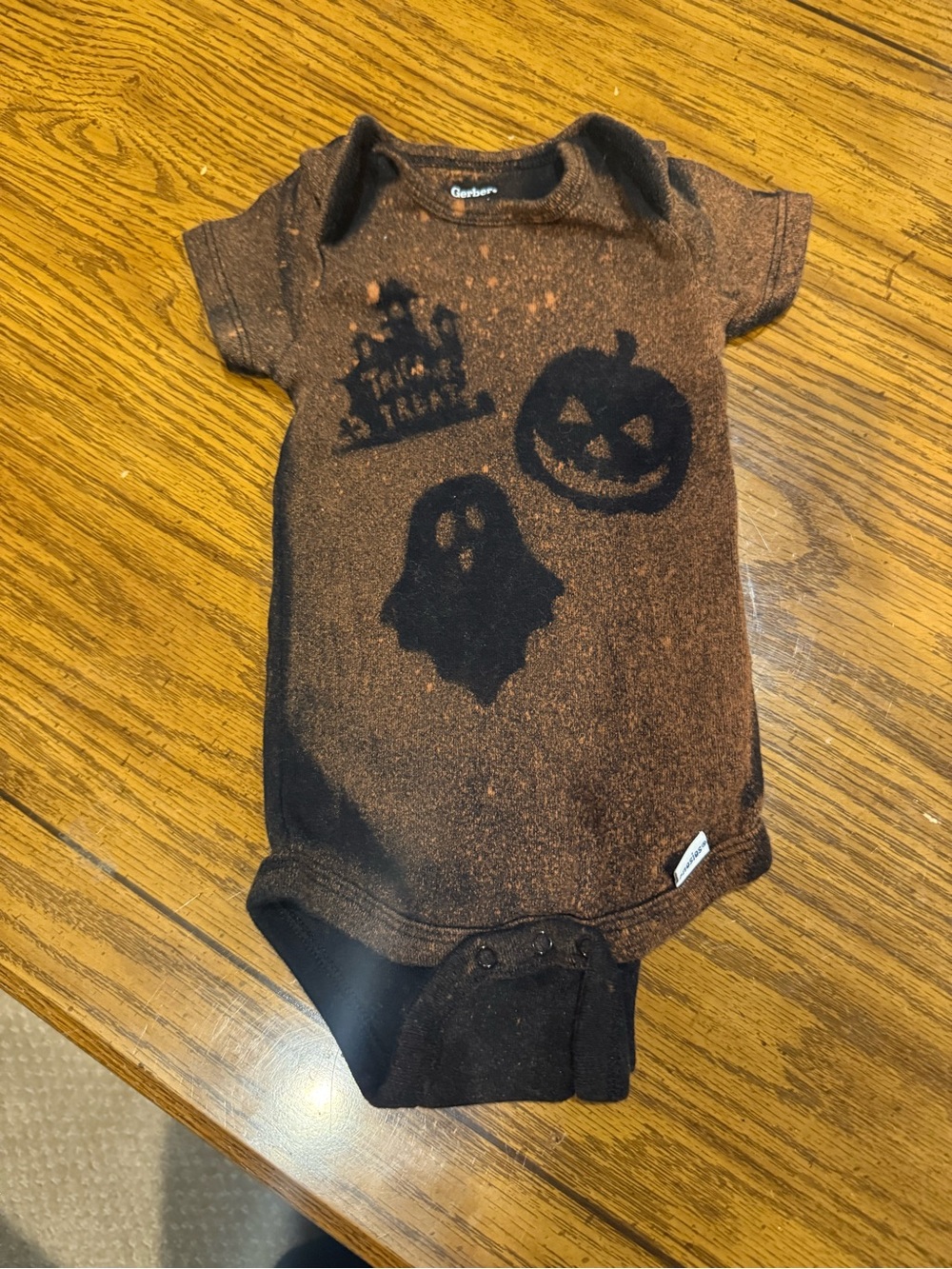 6 for $10 Gerber Black Baby Onesie with Orange Bleach Pumpkin Design